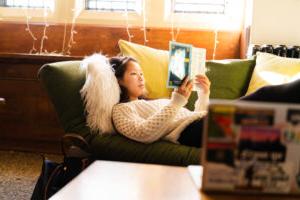 A trinity college student reading in their residence hall